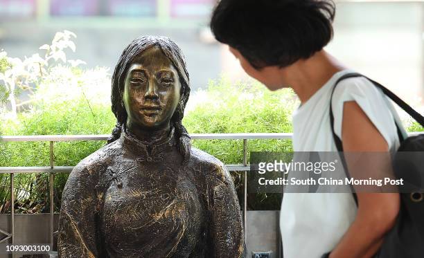 Members of Action Committee for Defending the Diaoyu Islands, place statues of two 'comfort women' near the Japanese consulate in Exchange Square....