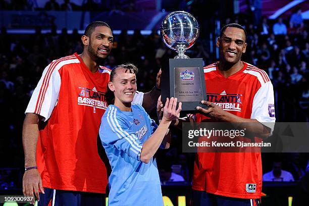Al Horford, Coco Miller and Steve Smith of Team Atlanta hold up the trophy after winning the Haier Shooting Stars Competition apart of NBA All-Star...