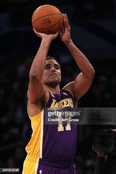 Rick Fox a former Los Angeles Lakers player and playing for Team Los Angeles competes in the Haier Shooting Stars Competition apart of NBA All-Star...