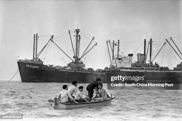 About 100 Vietnamese refugees from the freighter Skyluck jumped overboard in an attempt to swim to shore. The ship, with 2,600 refugees onboard, has...