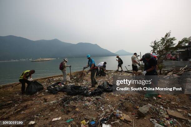 Volunteers cleaning rubbish at the seaside of Shek Tsai Po at Tai O after Typhoon Hato and Severe Tropical Storm Pakhar hit Hong Kong. 30AUG17. SCMP/...