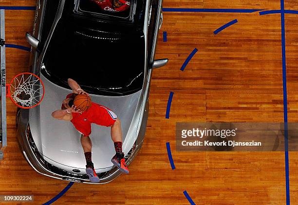 Blake Griffin of the Los Angeles Clippers dunks the ball over a car in the final round of the Sprite Slam Dunk Contest apart of NBA All-Star Saturday...