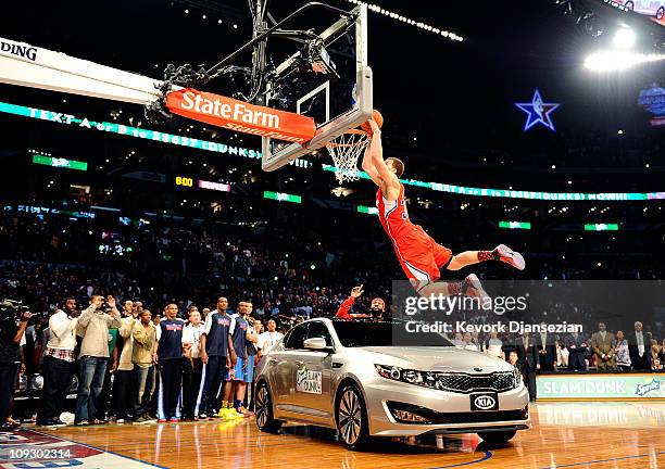 Blake Griffin of the Los Angeles Clippers dunks the ball over a car in the final round of the Sprite Slam Dunk Contest apart of NBA All-Star Saturday...