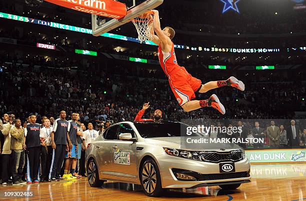 Blake Griffin from the L.A. Clippers slam dunks over a car with teammate Baron Davis inside, before winning the All-Stars Slam Dunk contest at the...