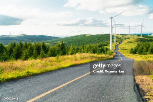 long asphalt road - mill hill stock pictures, royalty-free photos & images
