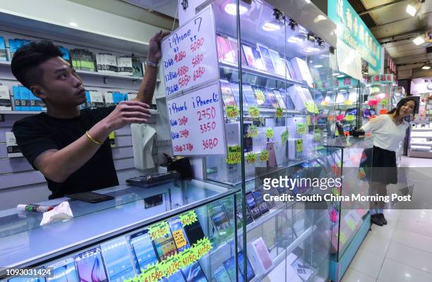 Photos of older versions of iPhones price drops as Apple launches the new iPhone 8 and iPhone X for preorder at a shop in Sin Tat Plaza in Mong Kok....