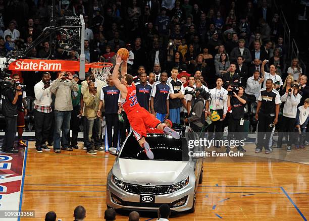 Blake Griffin of the Los Angeles Clippers dunks over a KIA during the Sprite Slam Dunk Contest during 2011 All-Star Saturday Night presented by State...