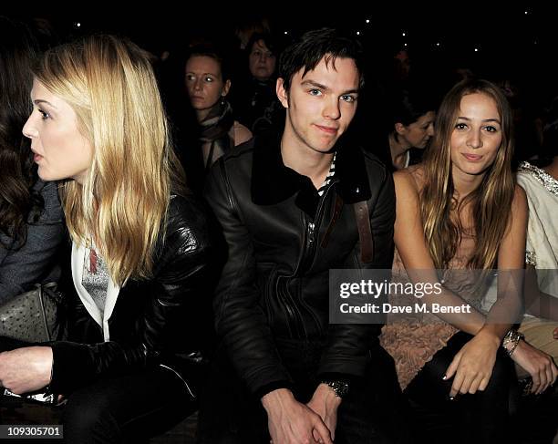 Rosamund Pike, Nicholas Hoult, and Harley Viera Newton sit in the front row at the Mulberry Salon Show at London Fashion Week Autumn/Winter 2011 at...