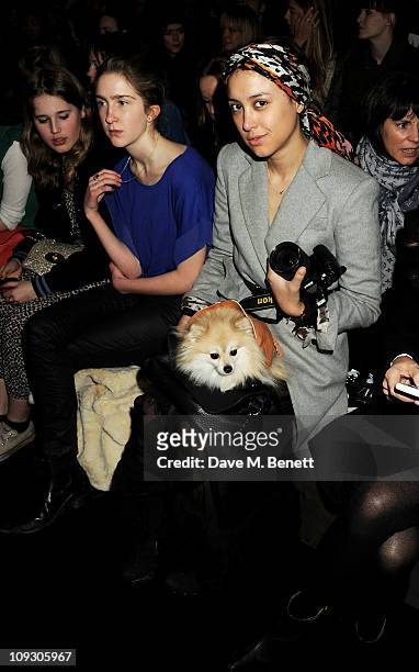 Kristin Knox with dog Butters sit in the front row at the Mulberry Salon Show at London Fashion Week Autumn/Winter 2011 at Claridge's Hotel on...