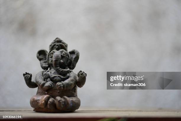 close up hindu god of success ganesha statue with copy space - clay stock pictures, royalty-free photos & images