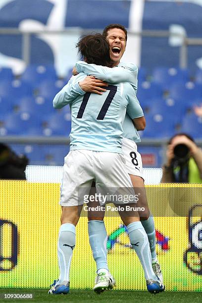 Hernanes with his teammate Giuseppe Sculli of SS Lazio celebrates after scoring the opening goal during the Serie A match between SS Lazio and AS...