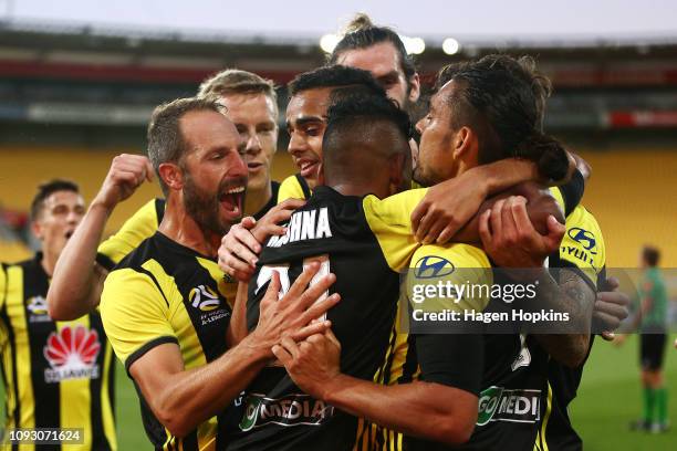 David Williams of the Phoenix celebrates with Roy Krishna and Andrew Durante after scoring a goal during the round 13 A-League match between the...