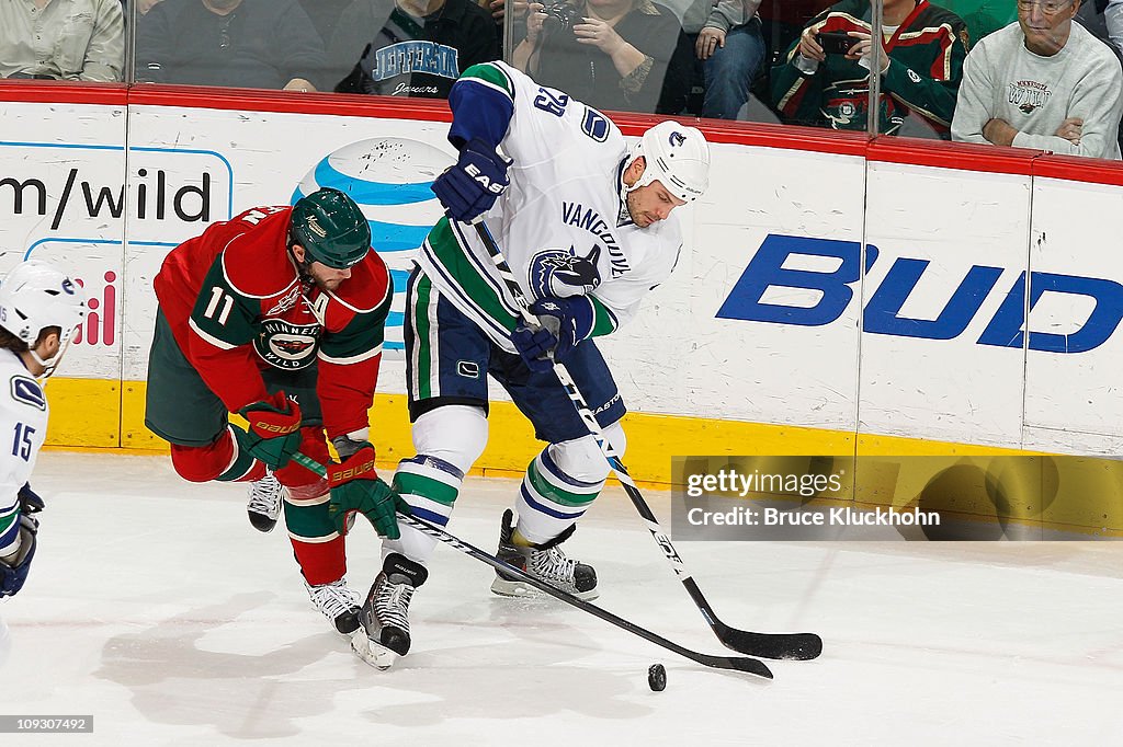 Aaron Rome Aaron Rome of the Vancouver Canucks and John Madden of the Minnesota ...