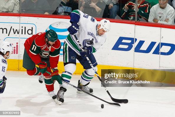 Aaron Rome Highlinght Aaron Rome of the Vancouver Canucks and John Madden of the Minnesota ...