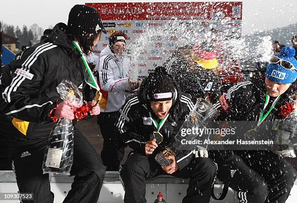 Skeleton athlete Anja Huber of team Germany 1 celebrates with champagne after the medal ceremony of the winning team Germany 2 with Marion Thees ,...