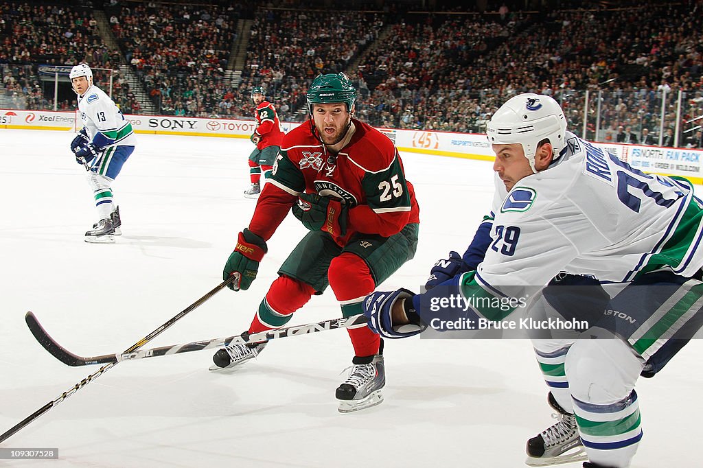 Aaron Rome Aaron Rome of the Vancouver Canucks delivers a pass while Cam Barker ...