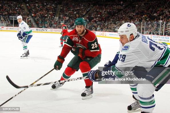 Aaron Rome Highlinght Aaron Rome of the Vancouver Canucks delivers a pass while Cam Barker ...