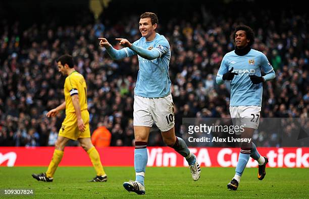 Edin Dzeko of Manchester City celebrates scoring their fourth goal during the FA Cup sponsored by E.On 4th Round replay match between Manchester City...