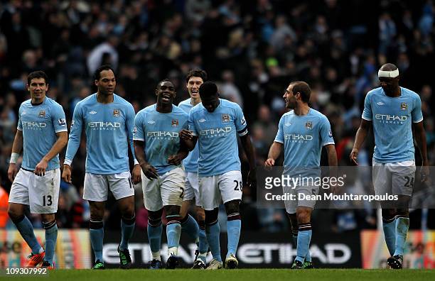 Micah Richards of Manchester City celebrates scoring the fifth goal with team mates during the FA Cup sponsored by E.On 4th Round replay match...
