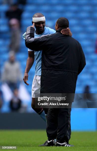 Notts County Manager Paul Ince, congratulates Partick Vieira of Manchester City during the FA Cup sponsored by E.On 4th Round replay match between...