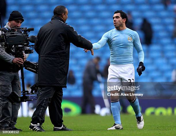 Notts County Manager Paul Ince, congratulates Carlos Tevez of Manchester City during the FA Cup sponsored by E.On 4th Round replay match between...