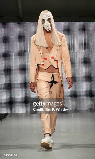Model walks the runway at the Charlie Le Mindu show during London Fashion Week Autumn/Winter 2011 at Mercer Studios on February 20, 2011 in London,...