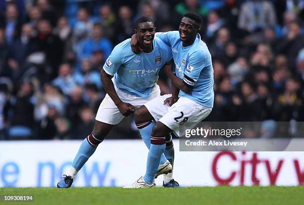 Micah Richards of Manchester City celebrates scoring the fifth goal with Kolo Toure during the FA Cup sponsored by E.On 4th Round replay match...