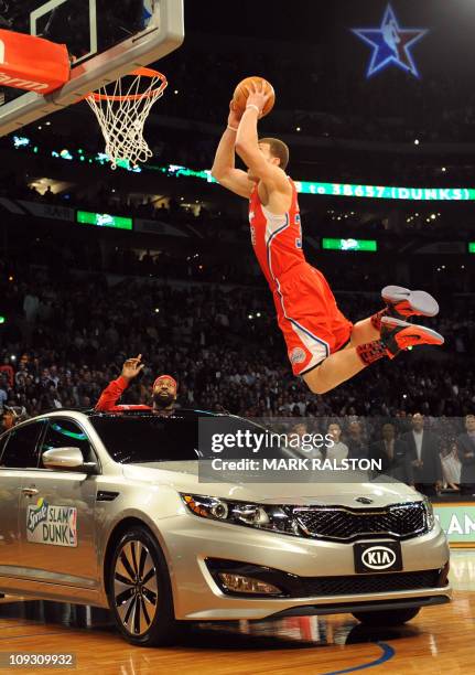 Blake Griffin from the L.A. Clippers slam dunks over a car with teammate Baron Davis inside, before winning the All-Stars Slam Dunk contest at the...