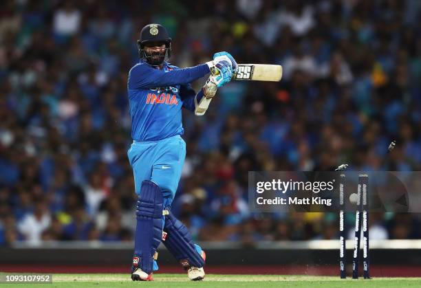 Dinesh Karthik of India is bowled by Jhye Richardson of Australia during game one of the One Day International series between Australia and India at...