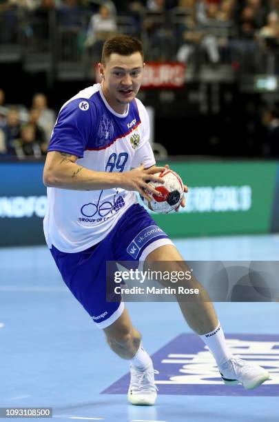 Dmitrii Zhitnikoiv of Russia controls the ball during the 26th IHF Men's World Championship group A match between Serbia and Russia at Mercedes-Benz...