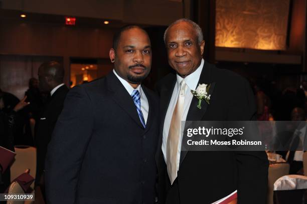 Lanero Hill and Former MLB Player and Hall of Famer Frank Robinson attend the 23rd Annual "A Candle in the Dark" Gala at the Hyatt Regency on...