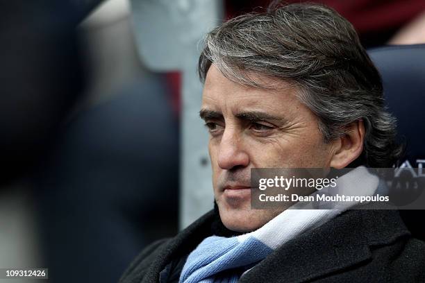 Man City manager Roberto Mancini looks on during the FA Cup sponsored by E.On 4th Round replay match between Manchester City and Notts County at City...