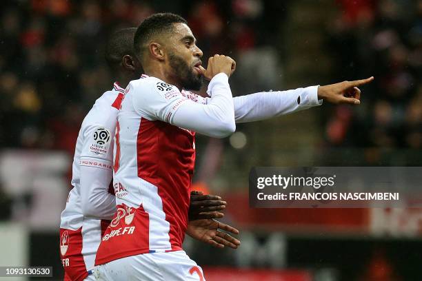 Reims' French defender Tristan Dingome celebrates after scoring during the French L1 football match between Stade de Reims and Olympique de Marseille...