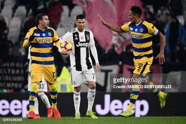 Parma's Italian midfielder Antonino Barilla celebrates with Parma's Portuguese defender Bruno Alves after scoring, as Juventus' Portuguese forward...