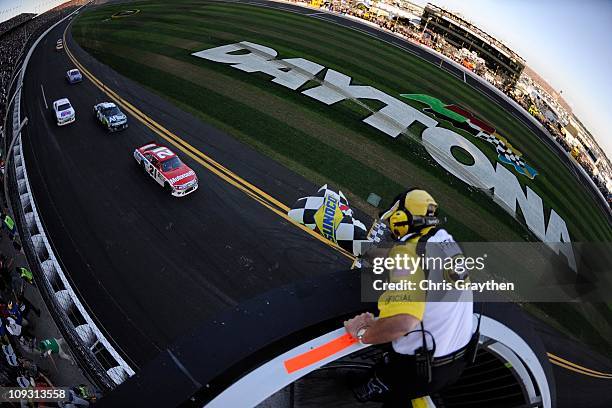 Trevor Bayne, driver of the Motorcraft/Quick Lane Ford, crosses the finish line to win the NASCAR Sprint Cup Series Daytona 500 at Daytona...