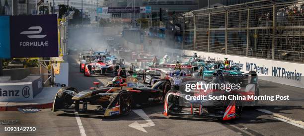 First lap of the first race at the Formula E Hong Kong E-Prix at Central Harbourfont. Pole-sitter Jean-Eric Vergne of Techeetah and Nick Heifeld of...