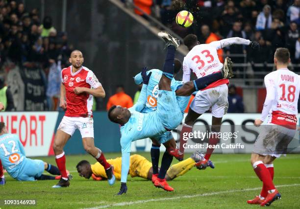 Mario Balotelli of Marseille in action while goalkeeper of Reims Edouard Mendy lies down during the french Ligue 1 match between Stade de Reims and...