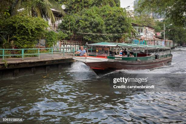 boat in a channel - sea channel stock pictures, royalty-free photos & images