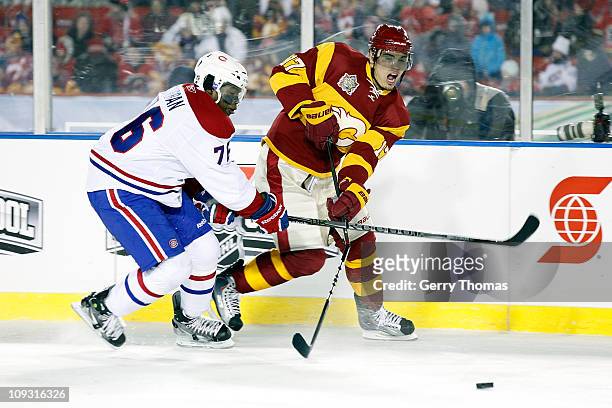Rene Bourque of the Calgary Flames has is sitck broken on a slash by PK Subban of the Montreal Canadiens on February 20, 2011 during the 2011...