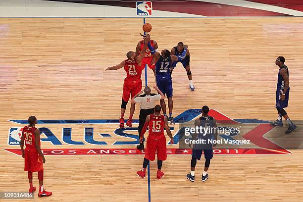 Tim Duncan of the San Antonio Spurs and the Western Conference and Dwight Howard of the Orlando Magic and the Eastern Conference go after the opening...