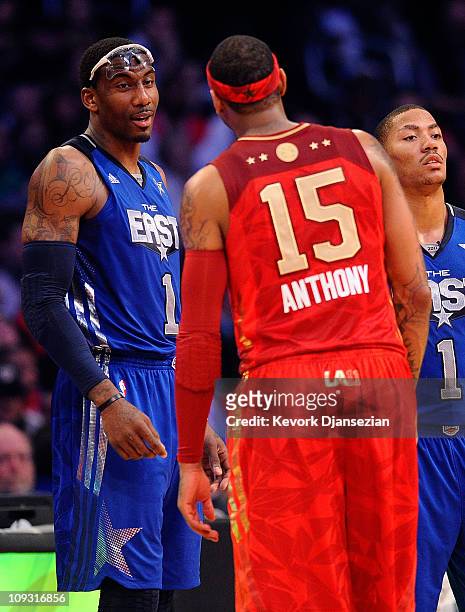 Amare Stoudemire of the New York Knicks and the Eastern Conference talks with Carmelo Anthony of the Denver Nuggets and the Western Conference in the...