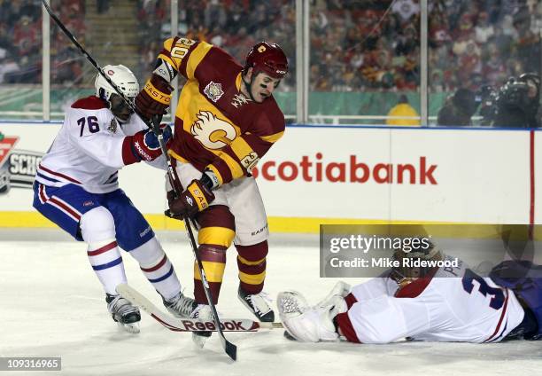 Subban and Carey Price of the Montreal Canadiens defend the net against Curtis Glencross of the Calgary Flames during the 2011 NHL Heritage Classic...