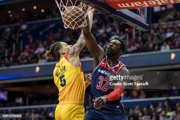 Jeff Green of the Washington Wizards dunks the ball against D.J. Wilson of the Milwaukee Bucks during the first half at Capital One Arena on February...