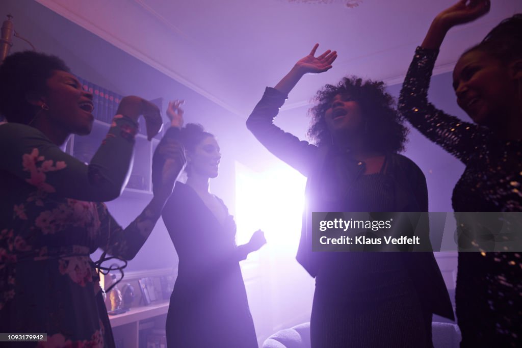 Young women making selfie while dancing