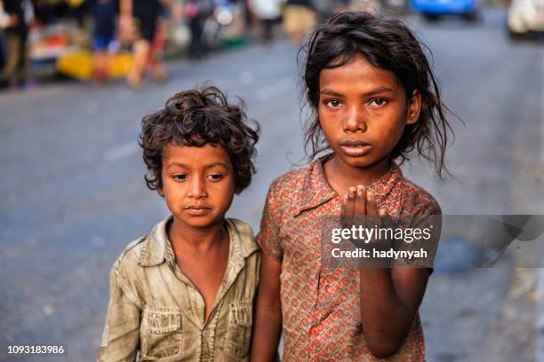 poor indian children asking for help - child begging stock pictures, royalty-free photos & images