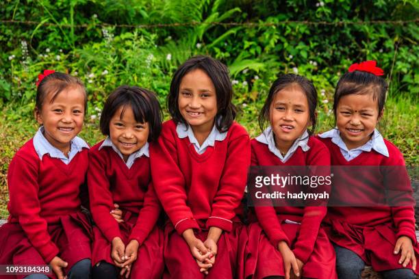 nepali schoolgirls  in village near annapurna range - nepal stock pictures, royalty-free photos & images