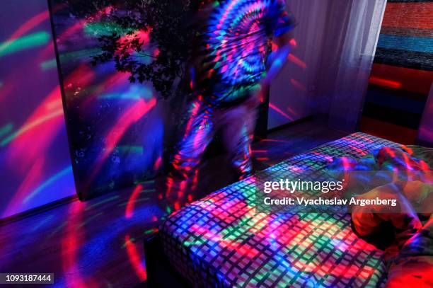 disco style lights, rotating disco ball ceiling light - música ambient fotografías e imágenes de stock