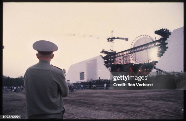 Security guard watches as the stage is built for Roger Waters' The Wall concert in Potzdamer Platz, Berlin, on 20th July 1990.