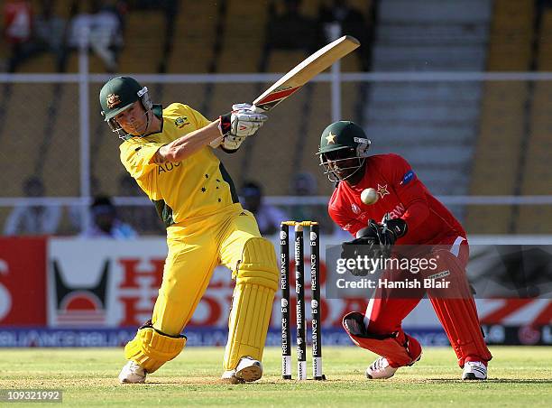 Michael Clarke of Australia pulls with Tatenda Taibu of Zimbabwe looking on during the 2011 ICC World Cup Group A match between Australia and...