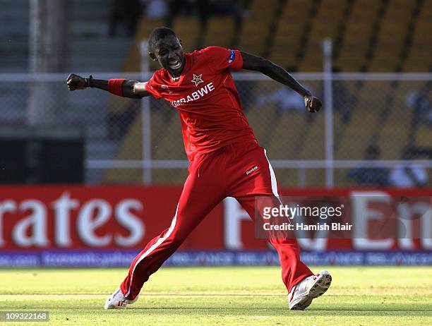 Chris Mpofu of Zimbabwe celebrates after taking the wicket of Cameron White of Australia during the 2011 ICC World Cup Group A match between...